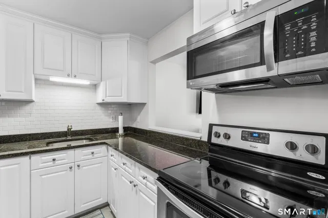 a kitchen with a stove and a microwave