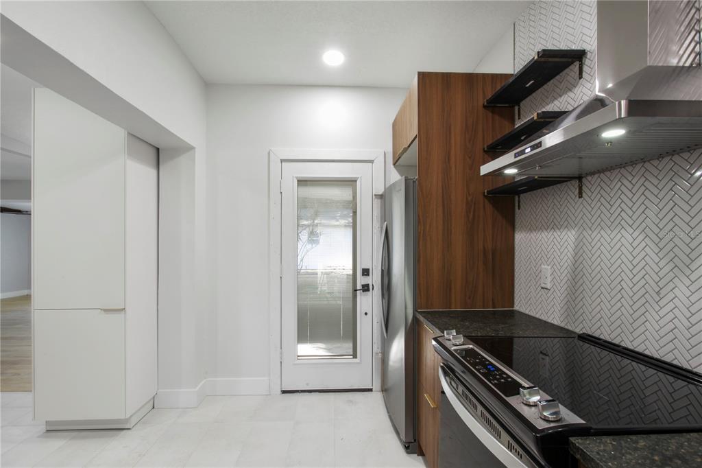 1407 Berwyn Road Orlando, FL 32806 - Photo 12 of 42 a view of an empty room and wooden floor