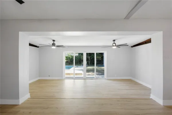 a view of an empty room with a window