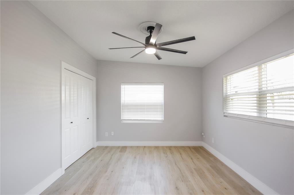 1407 Berwyn Road Orlando, FL 32806 - Photo 20 of 42 a view of an empty room with wooden floor and a window