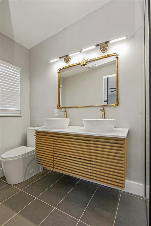 1407 Berwyn Road Orlando, FL 32806 - Photo 21 of 42 a bathroom with a sink and a mirror