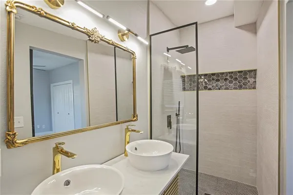 a bathroom with a sink and a mirror