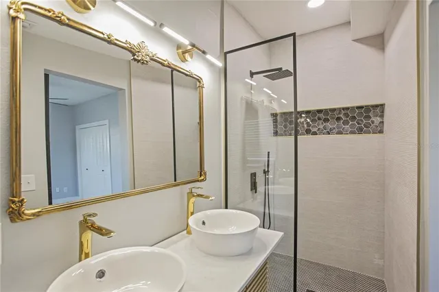 a bathroom with a sink and a mirror
