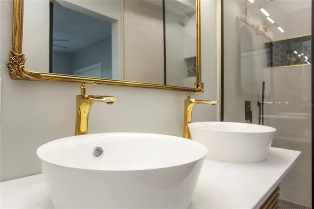 a white bath tub sitting next to a white sink