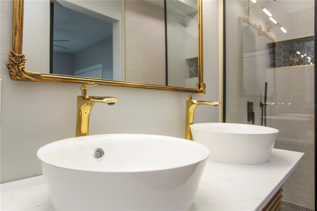 1407 Berwyn Road Orlando, FL 32806 - Photo 24 of 42 a white bath tub sitting next to a white sink