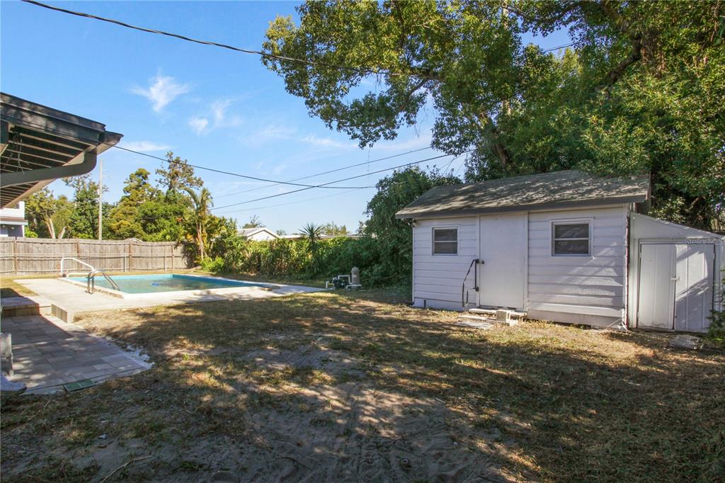 1407 Berwyn Road Orlando, FL 32806 - Photo 35 of 42 a view of a house with a yard