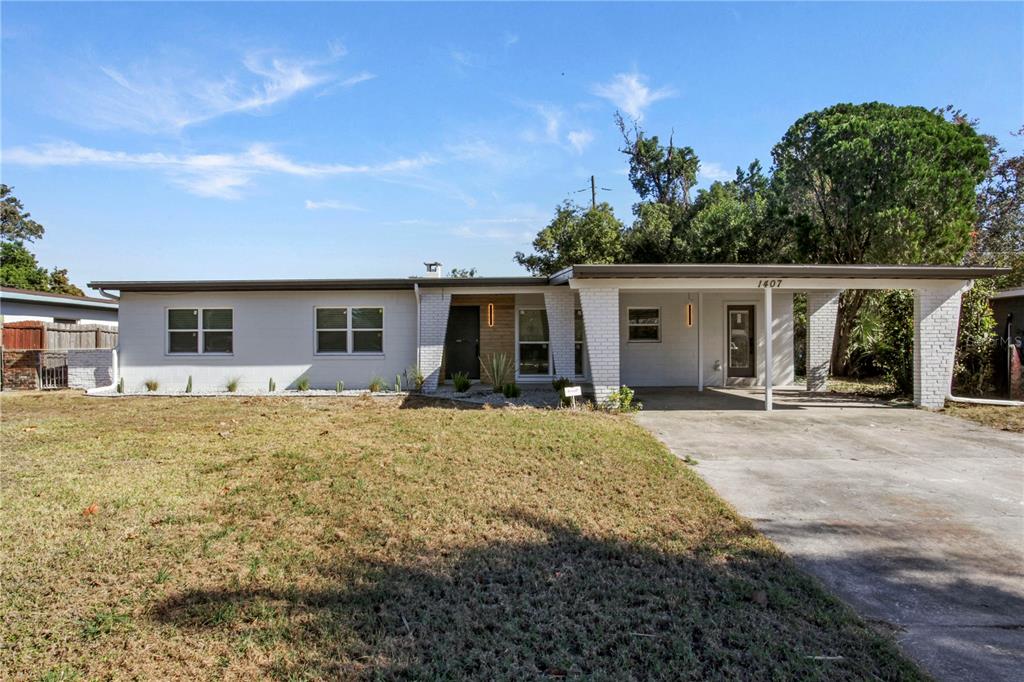 1407 Berwyn Road Orlando, FL 32806 - Photo 40 of 42 front view of a house with a patio