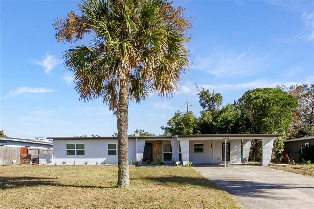 1407 Berwyn Road Orlando, FL 32806 - Photo 41 of 42 front view of house with a small yard