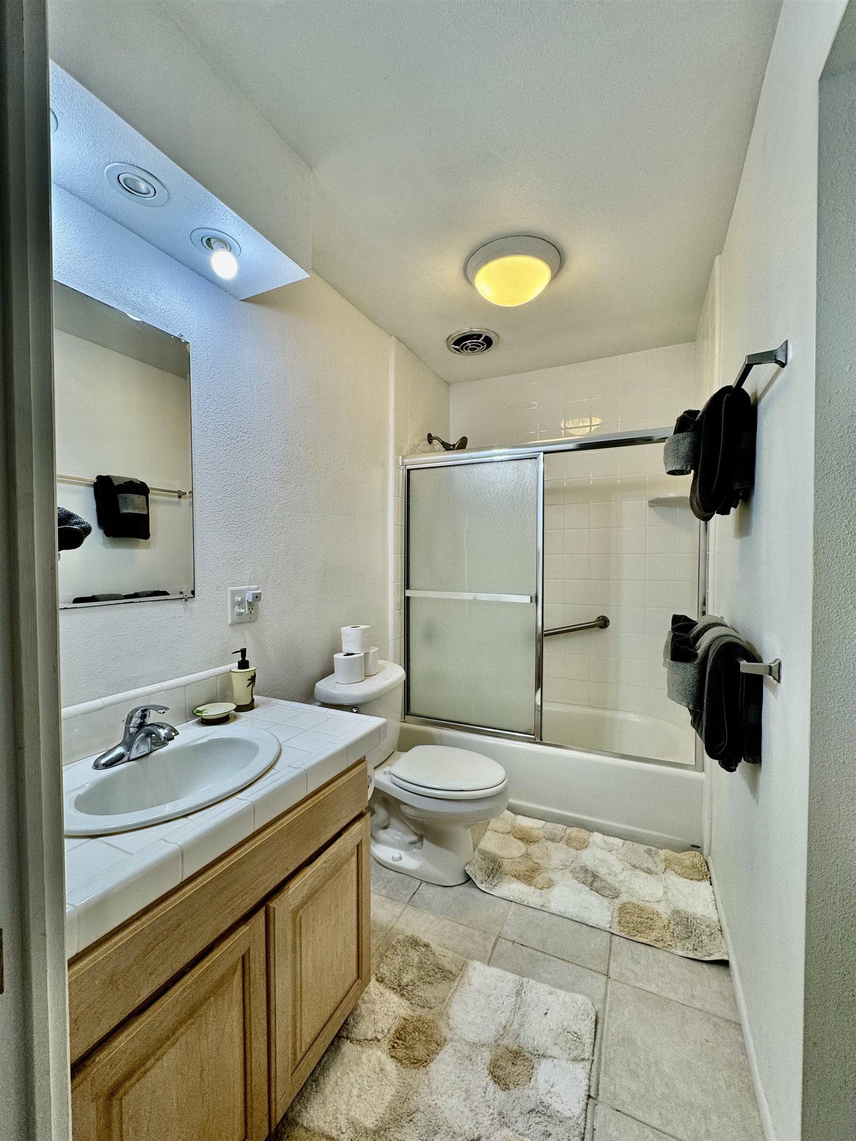 7142 Kamehameha V Highway, Unit A110 Kaunakakai, HI 96748 - Photo 13 of 20 a bathroom with a sink a toilet and shower