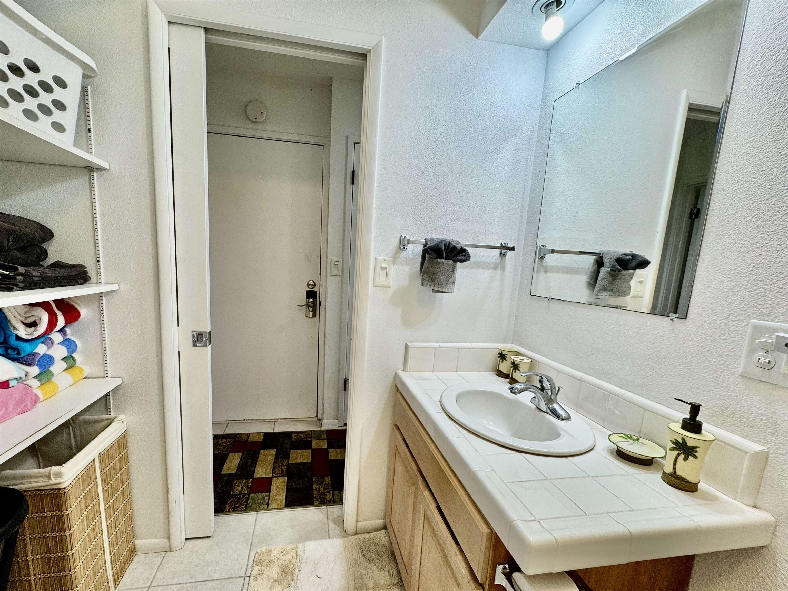 7142 Kamehameha V Highway, Unit A110 Kaunakakai, HI 96748 - Photo 14 of 20 a bathroom with a sink and a mirror