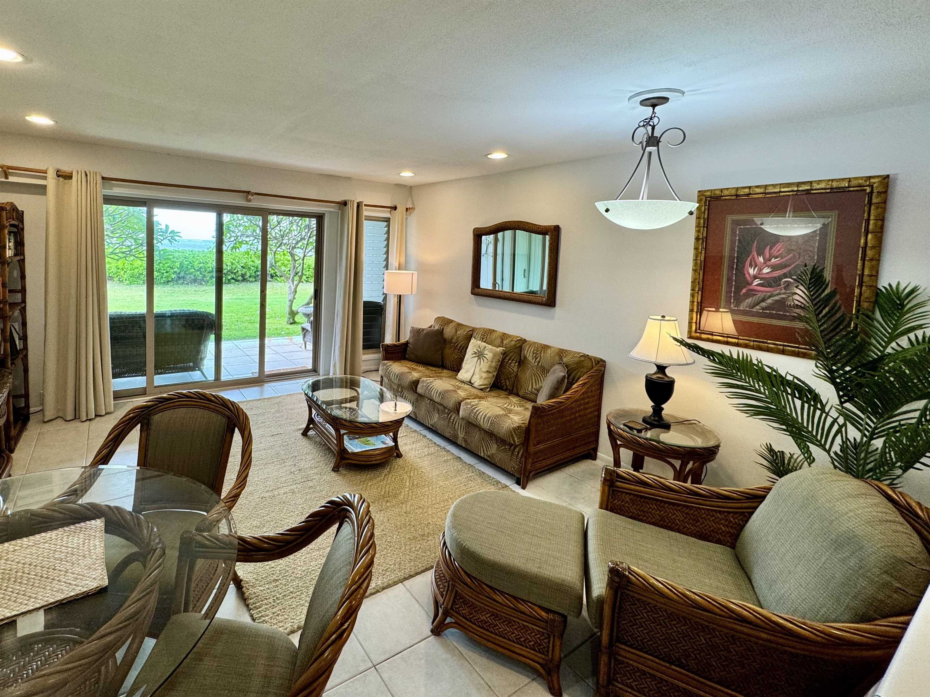 7142 Kamehameha V Highway, Unit A110 Kaunakakai, HI 96748 - Photo 2 of 20 a living room with furniture and a large window