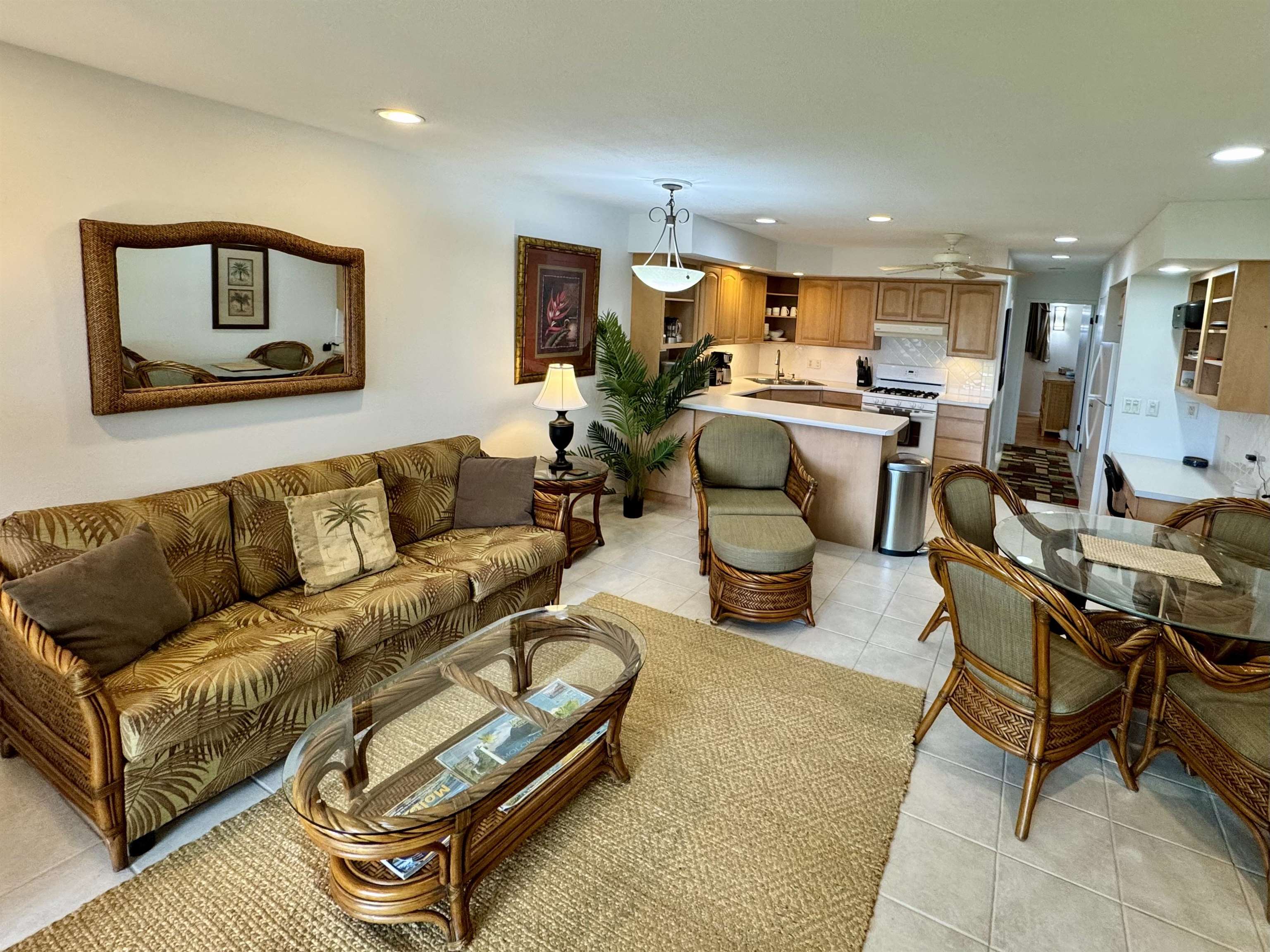 7142 Kamehameha V Highway, Unit A110 Kaunakakai, HI 96748 - Photo 3 of 20 a living room with furniture kitchen and a table