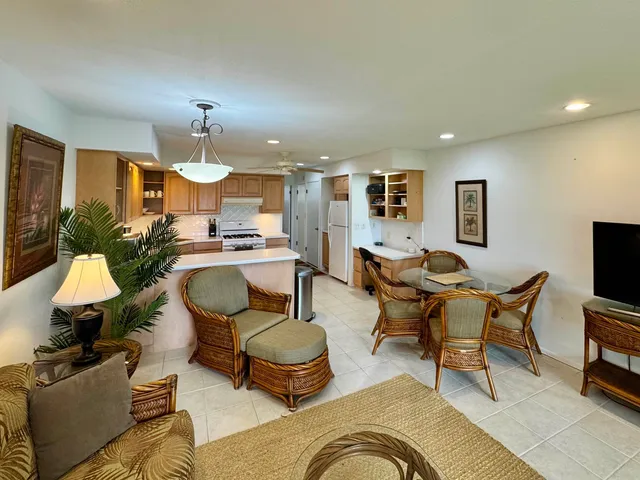 a living room with furniture and a lamp