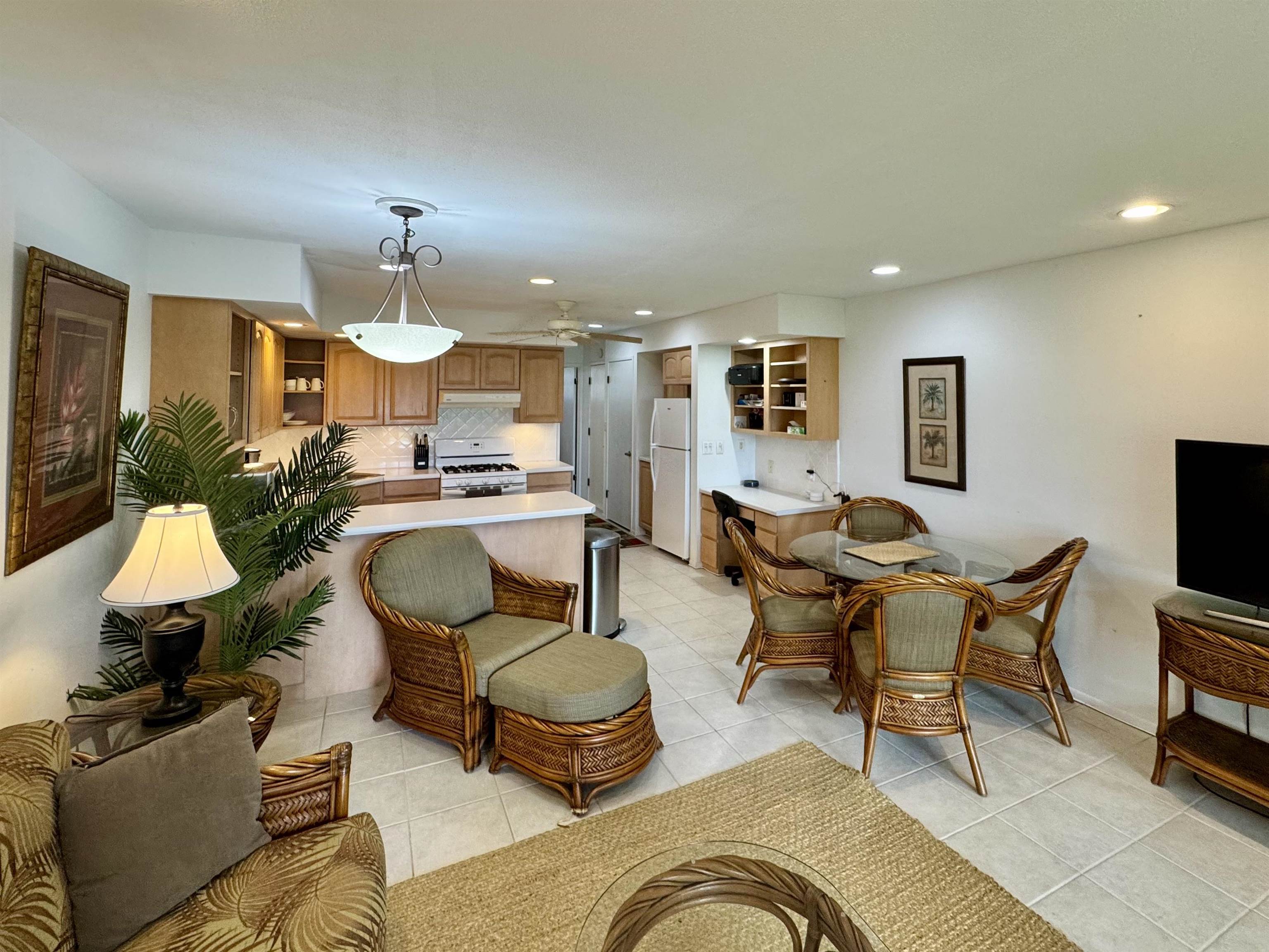 7142 Kamehameha V Highway, Unit A110 Kaunakakai, HI 96748 - Photo 4 of 20 a living room with furniture and a lamp