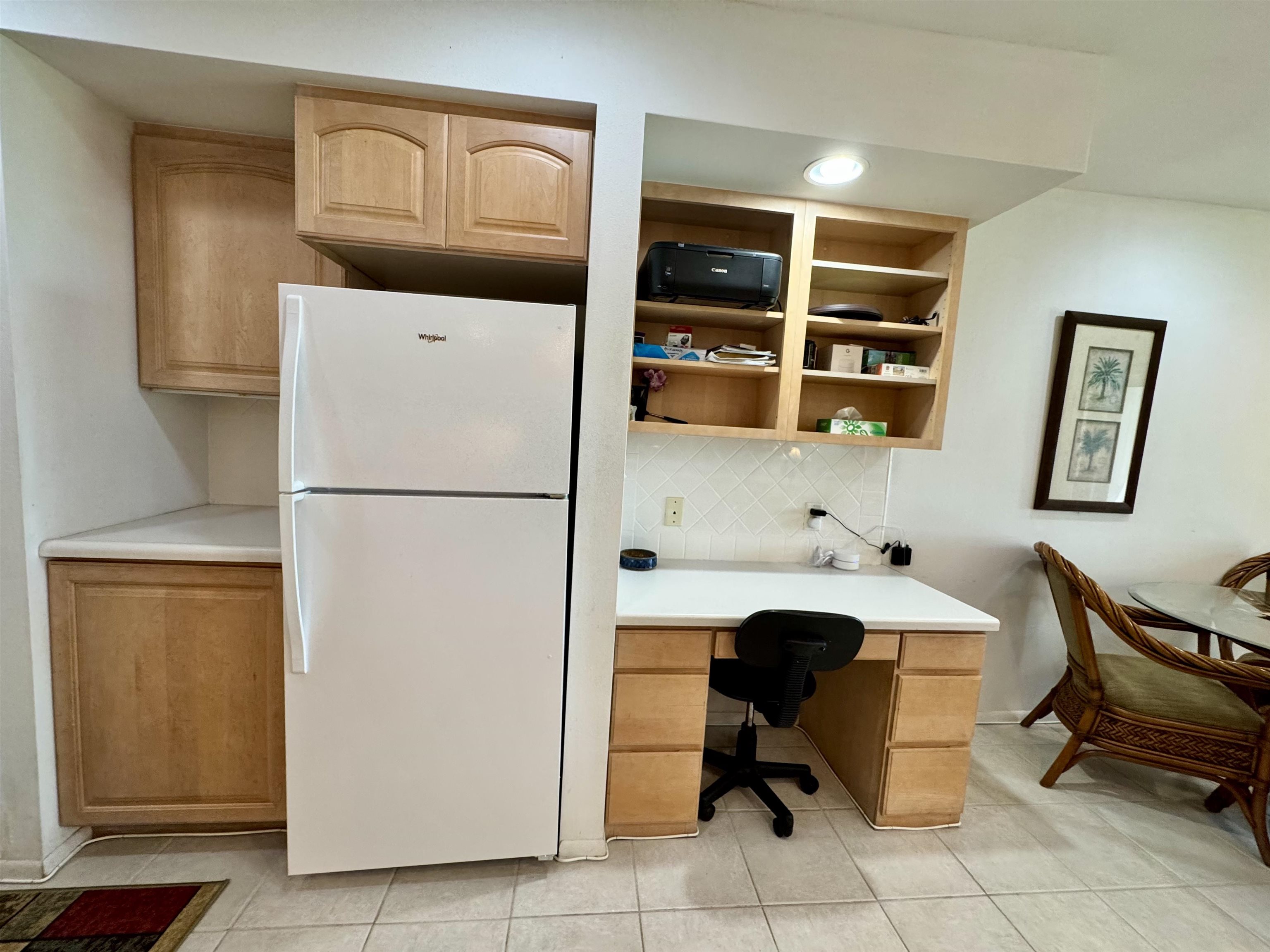 7142 Kamehameha V Highway, Unit A110 Kaunakakai, HI 96748 - Photo 9 of 20 a workspace with stainless steel appliances refrigerator and cabinets