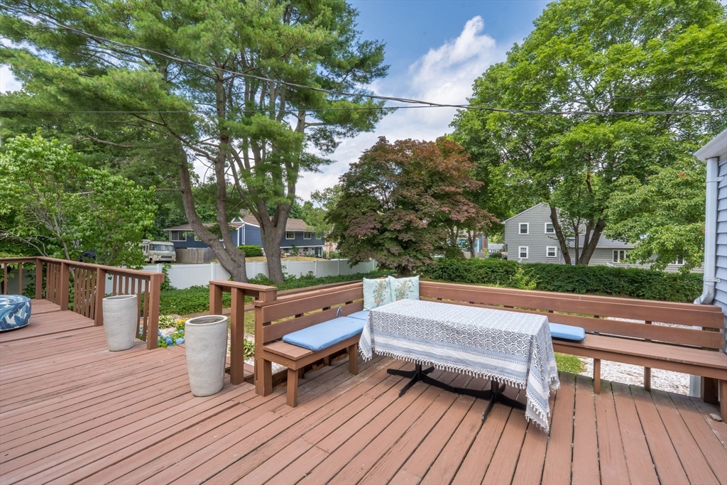 172 Union Street Weymouth, MA 02190 - Photo 30 of 40 a view of a wooden deck with furniture and trees