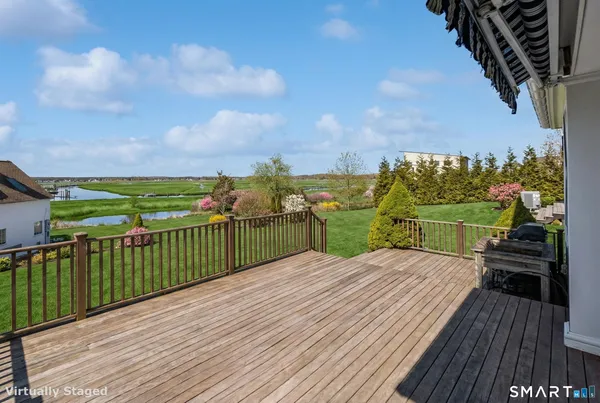 a view of a patio with wooden floor
