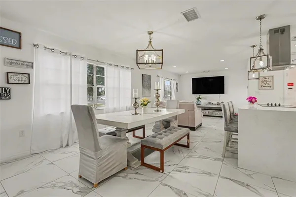 a view of a livingroom with furniture and a flat screen tv