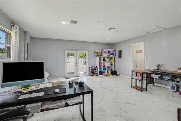 a view of a workspace with furniture