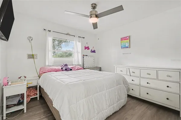 a bedroom with a bed and a dresser