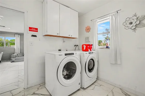 a utility room with dryer and washer