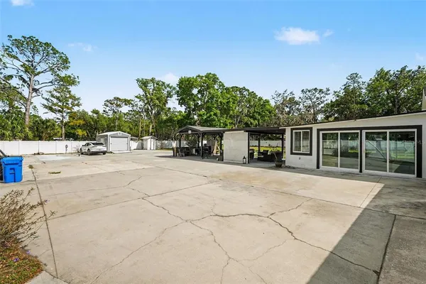 a view of house with outdoor space and sitting area