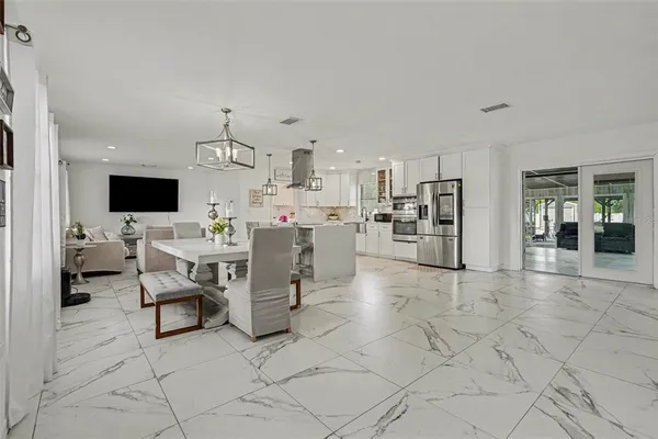 a view of kitchen with furniture and flat screen tv