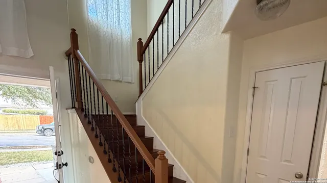 a view of staircase with wooden floor and staircase