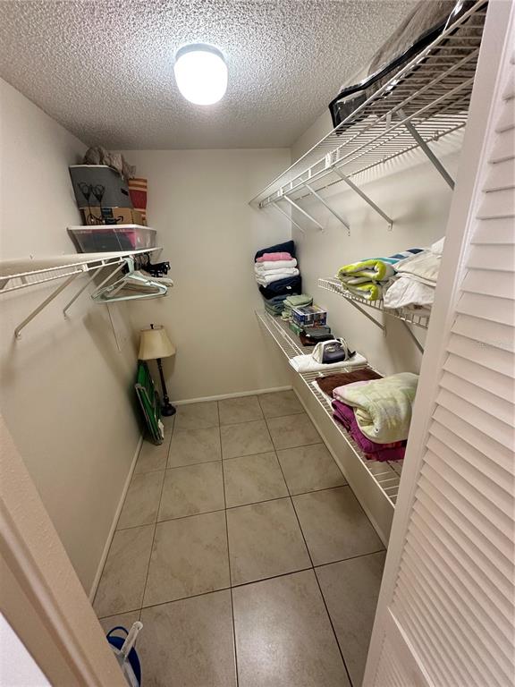 3846 59th Avenue West, Unit 3846 Bradenton, FL 34210 - Photo 12 of 25 a view of an empty room with shelves