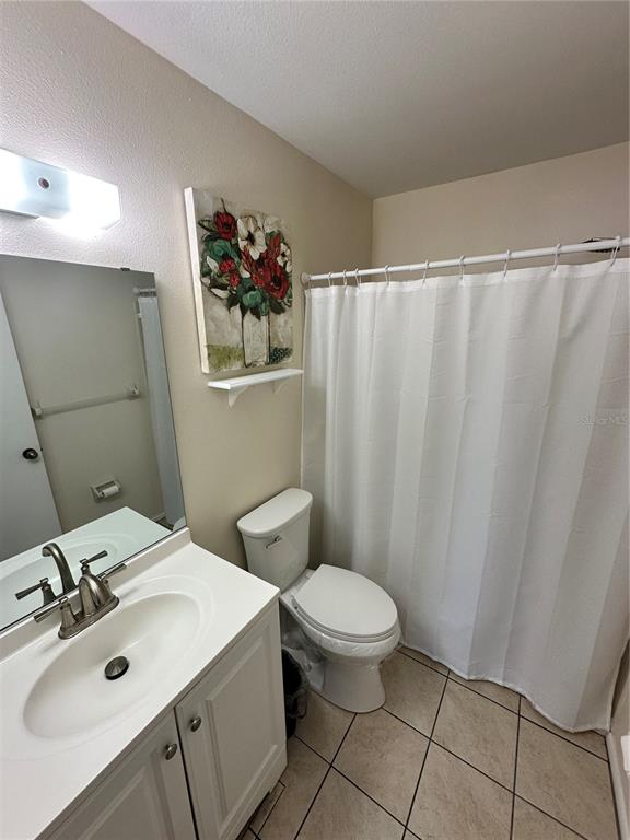 3846 59th Avenue West, Unit 3846 Bradenton, FL 34210 - Photo 13 of 25 a bathroom with a sink toilet and shower