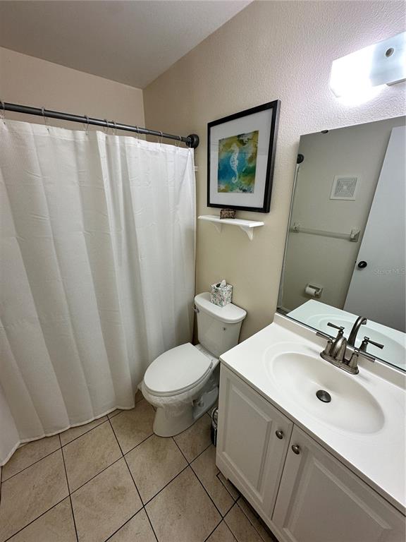 3846 59th Avenue West, Unit 3846 Bradenton, FL 34210 - Photo 17 of 25 a bathroom with a sink toilet and shower