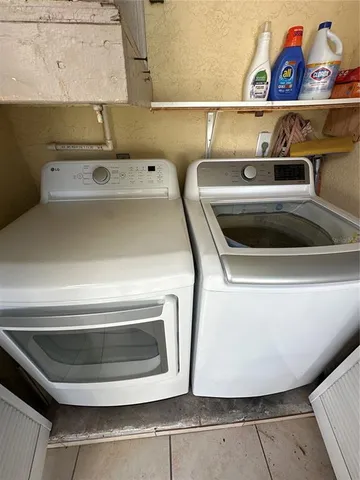 a view of swimming pool with outdoor seating and plants