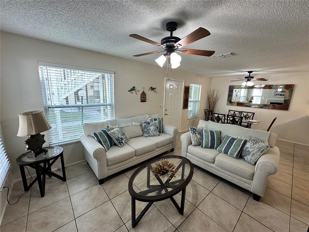 3846 59th Avenue West, Unit 3846 Bradenton, FL 34210 - Photo 4 of 25 a view of a livingroom with furniture and a large window