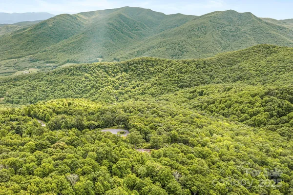 a view of a town with mountains in the background