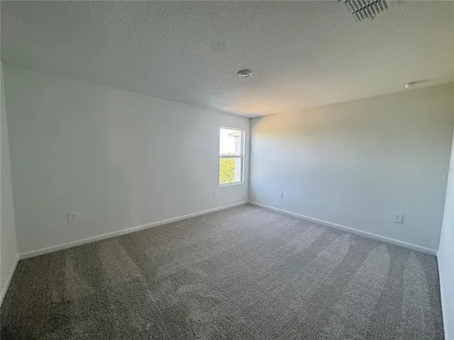an empty room that has window