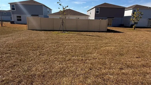 a view of a house with a snow in the yard