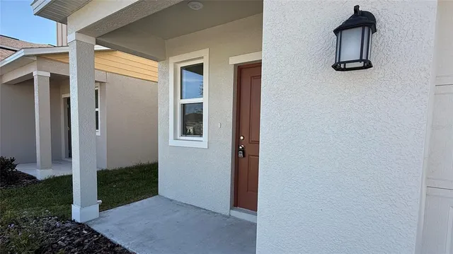 view of room with window and entryway