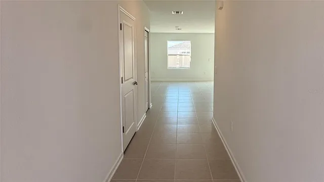 a view of a hallway with windows