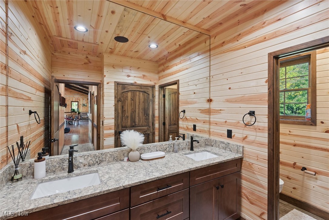 290 Townline Road Aurora, OH 44202 - Photo 26 of 50 Full bath featuring wooden walls, double vanity, recessed lighting, and wood ceiling