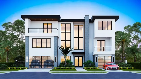 a front view of residential houses with yard