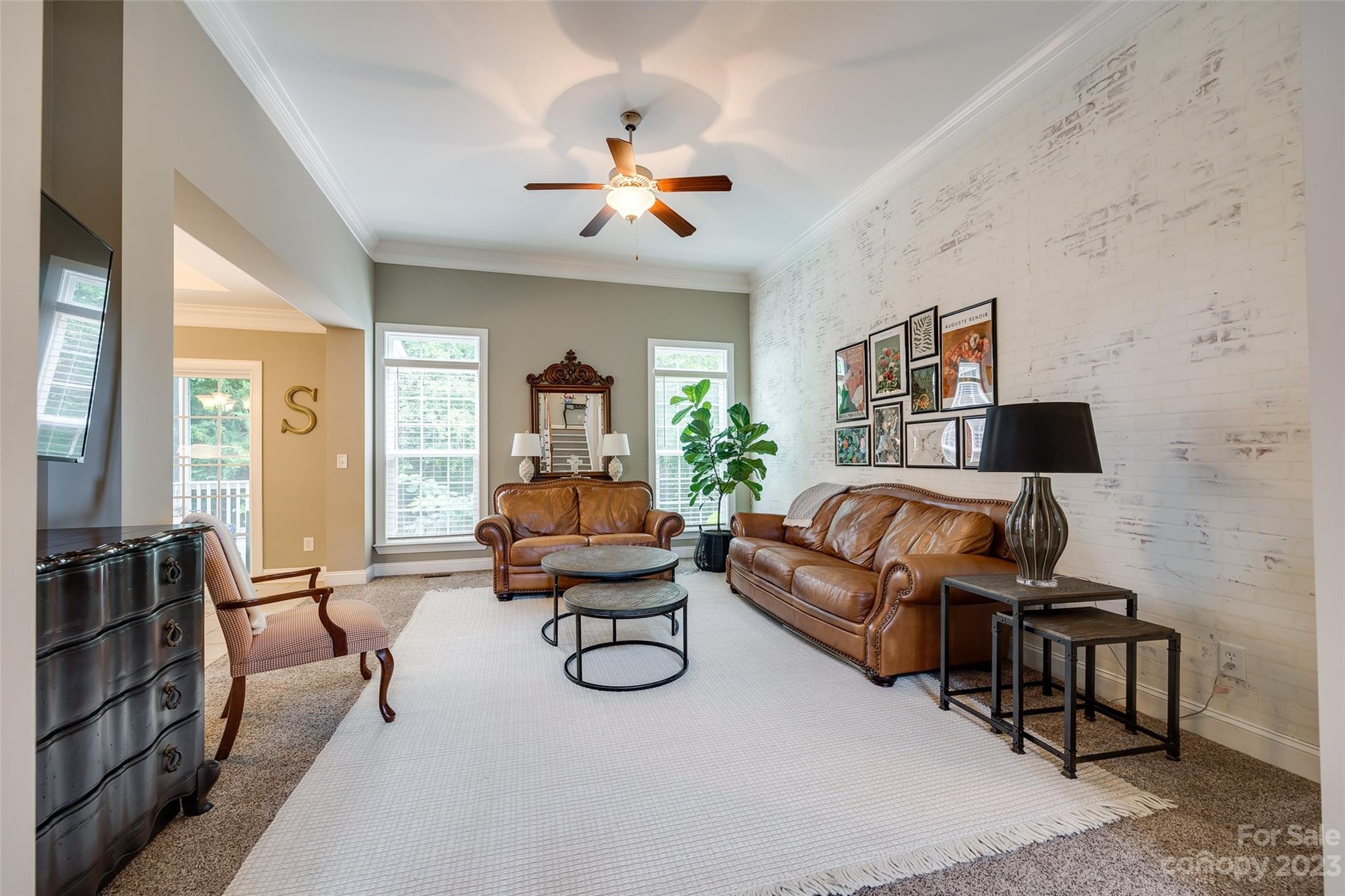 4142 Sunset Ridge Drive, Unit 117 Rock Hill, SC 29732 - Photo 12 of 48 a living room with furniture and a chandelier