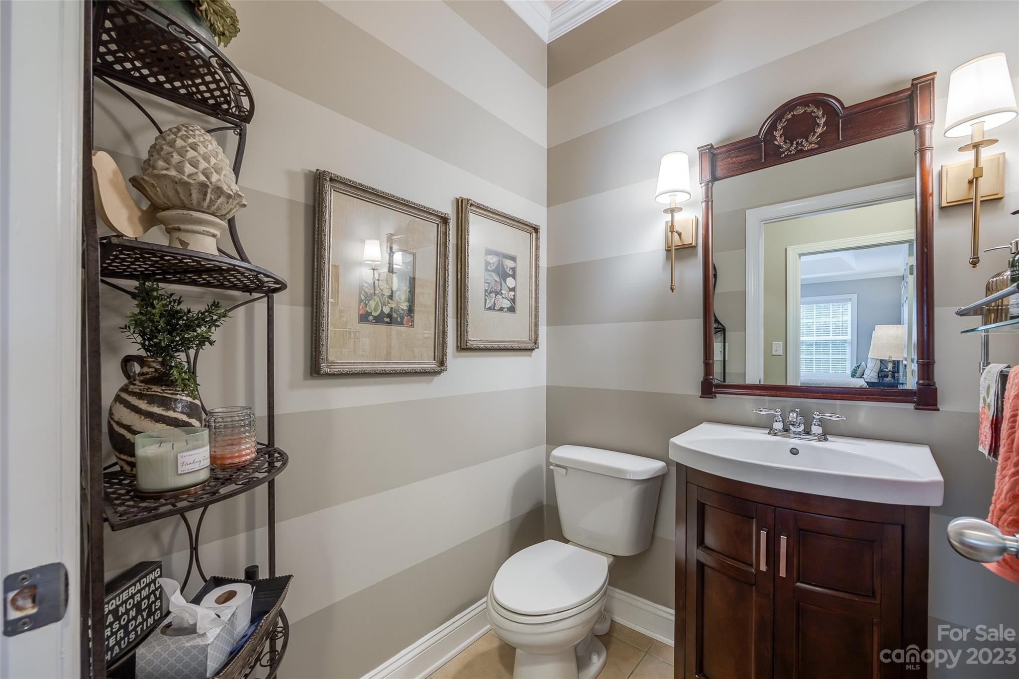 4142 Sunset Ridge Drive, Unit 117 Rock Hill, SC 29732 - Photo 15 of 48 a bathroom with a toilet a sink and mirror