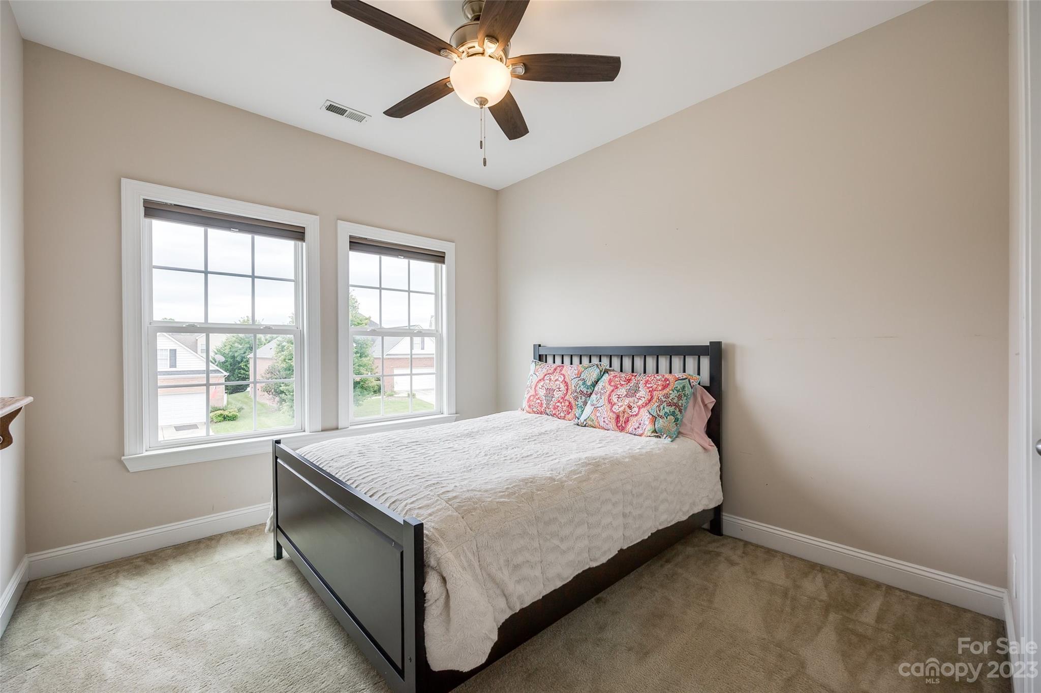4142 Sunset Ridge Drive, Unit 117 Rock Hill, SC 29732 - Photo 23 of 48 a bed sitting in a bedroom next to a window