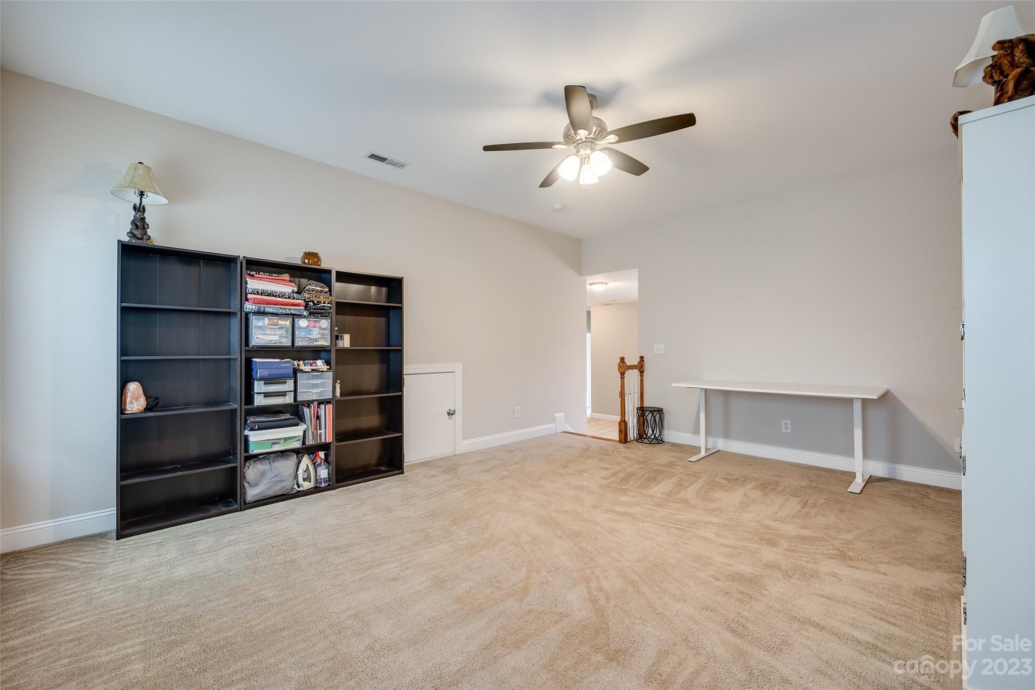 4142 Sunset Ridge Drive, Unit 117 Rock Hill, SC 29732 - Photo 31 of 48 a view of an empty room with closet and racks on the wall