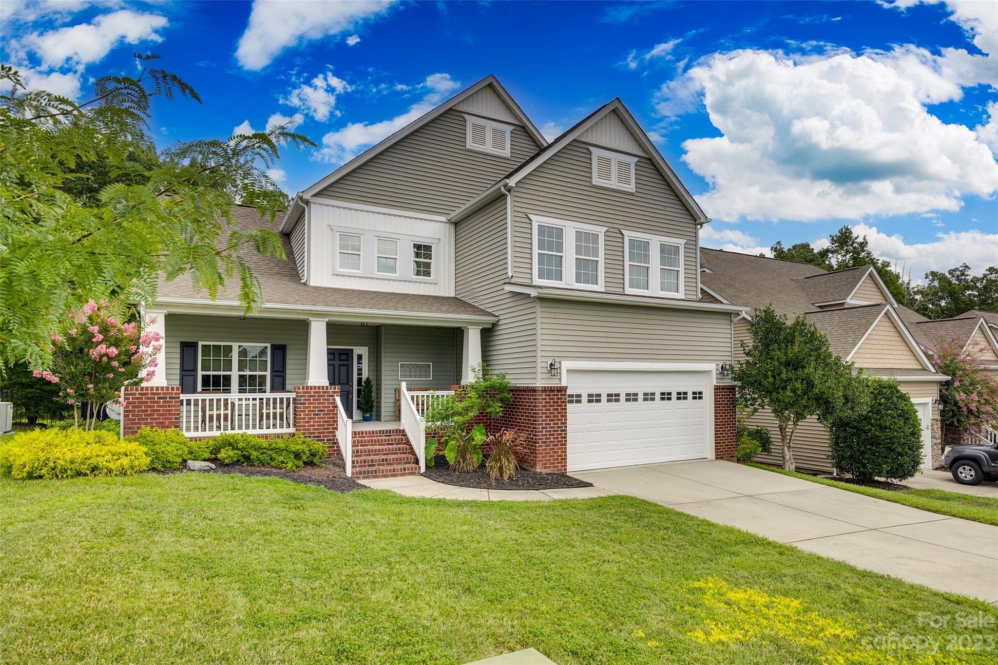 4142 Sunset Ridge Drive, Unit 117 Rock Hill, SC 29732 - Photo 38 of 48 a front view of a house with a yard and garage