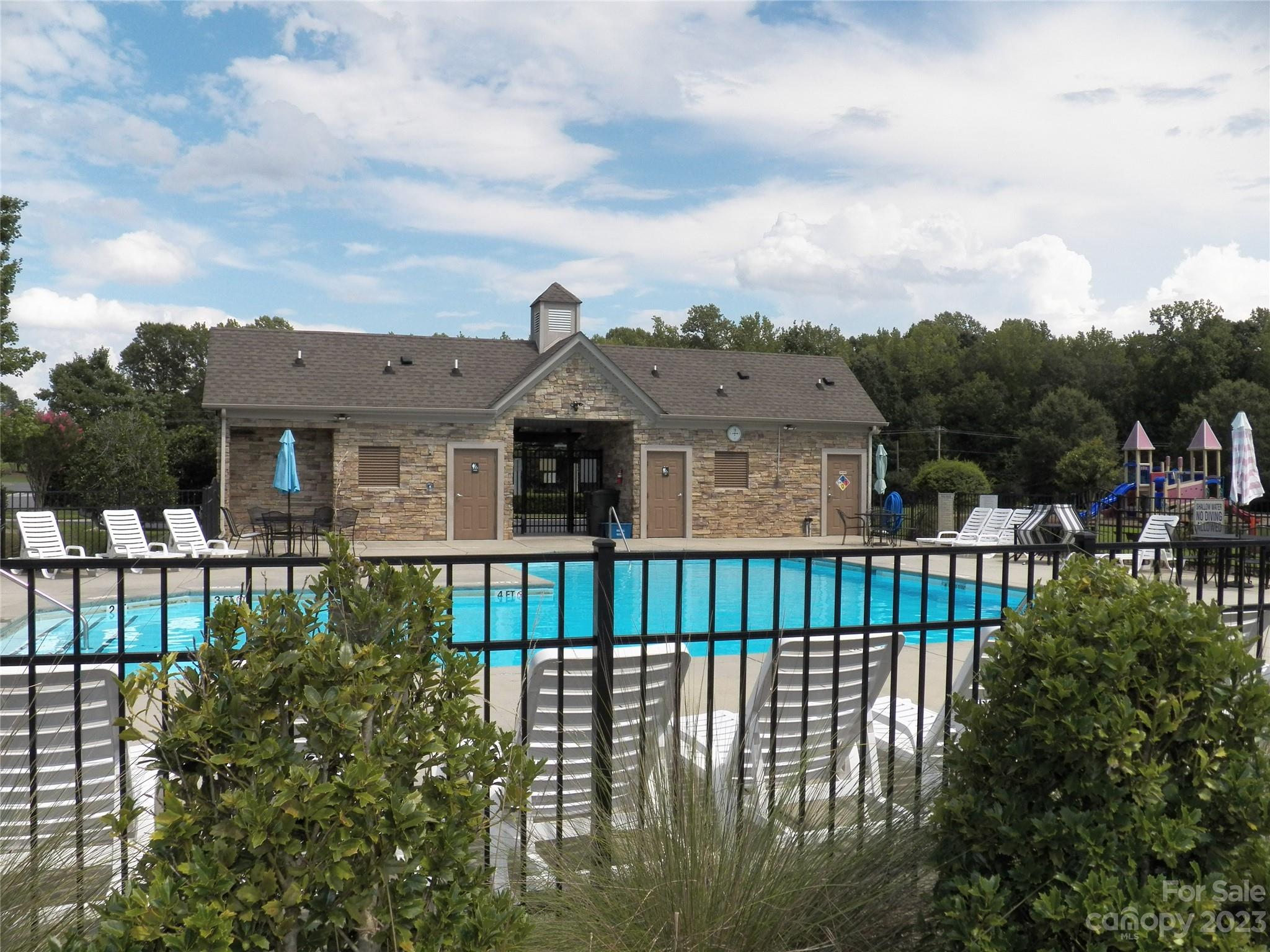 4142 Sunset Ridge Drive, Unit 117 Rock Hill, SC 29732 - Photo 47 of 48 a view of a house with a small yard and plants