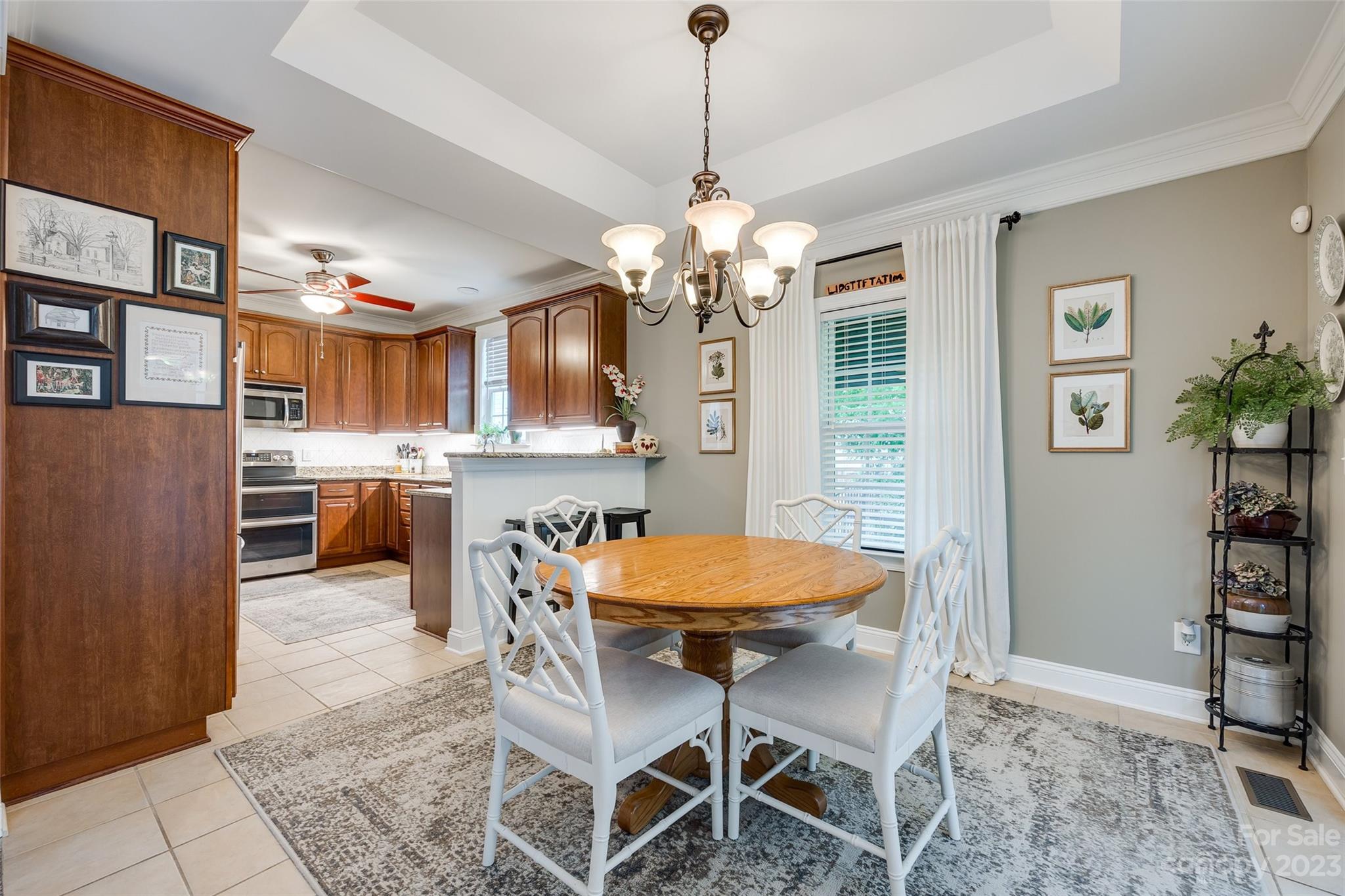 4142 Sunset Ridge Drive, Unit 117 Rock Hill, SC 29732 - Photo 10 of 48 a view of a dining room with furniture and a chandelier