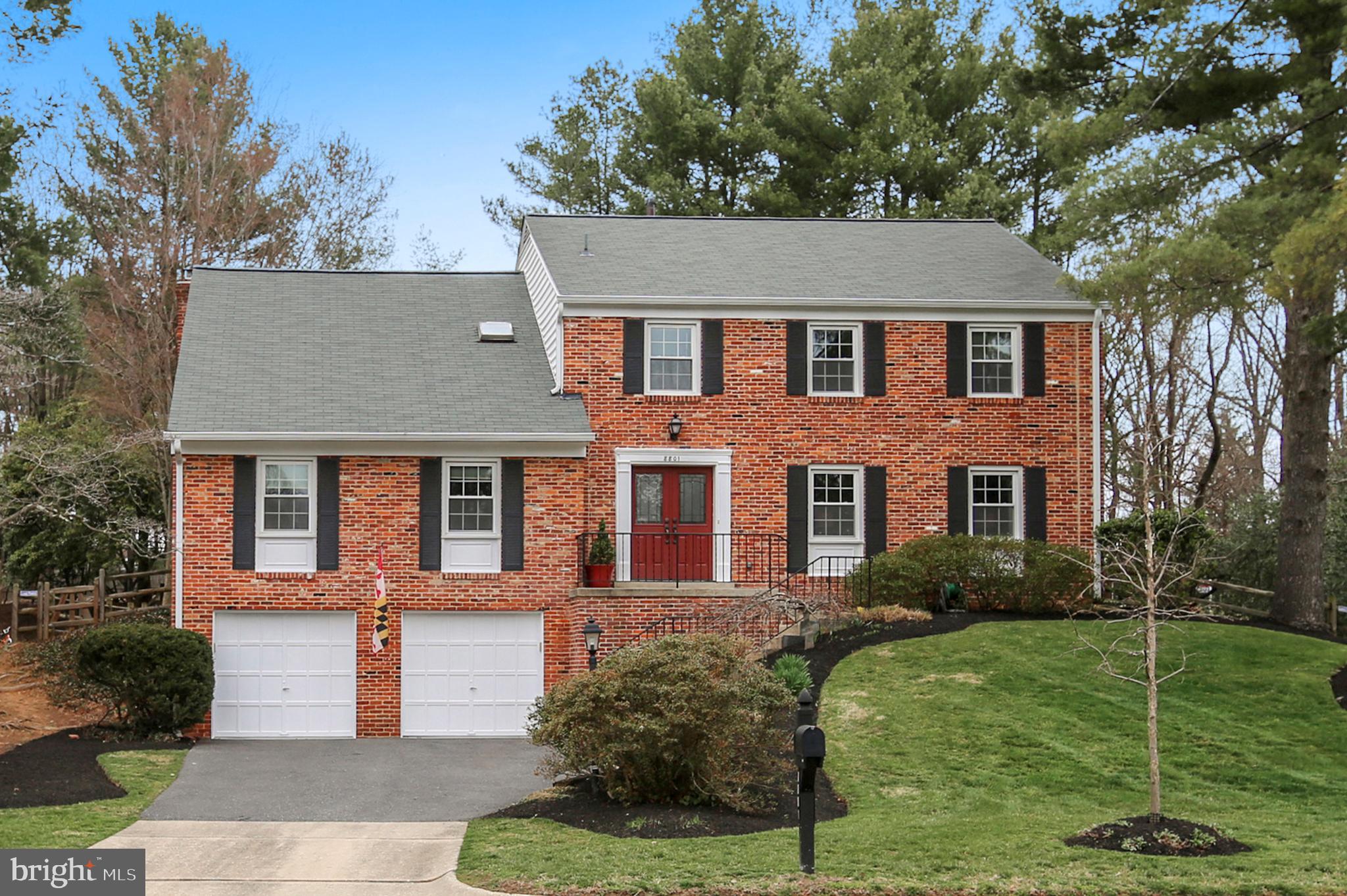 8801 Cold Spring Road Potomac, MD 20854 - Photo 1 of 44 a front view of a house with a yard