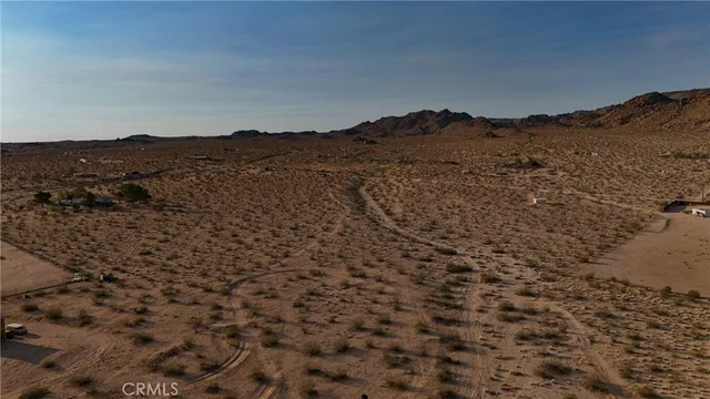 a view of mountains and valleys in the background