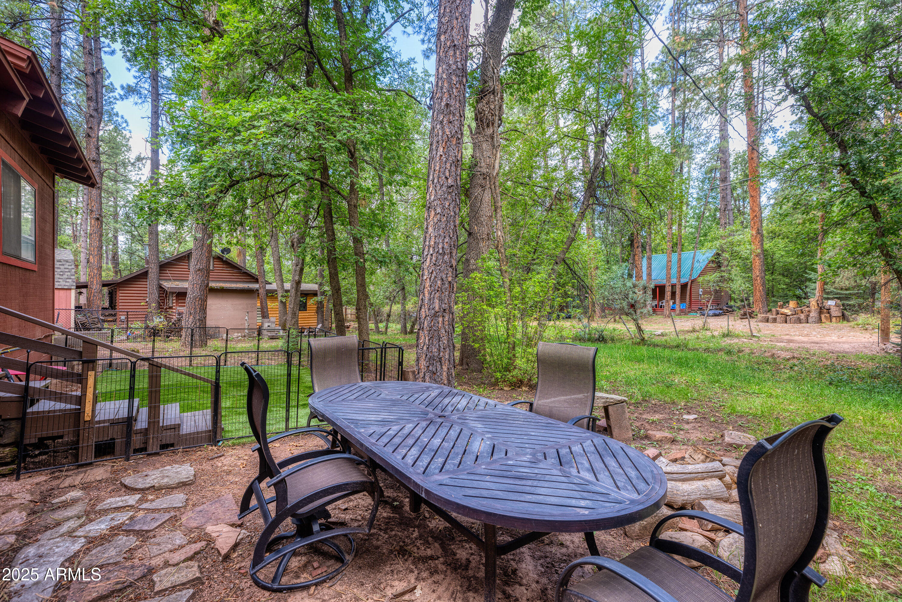286 West Columbine Road Payson, AZ 85541 - Photo 13 of 17 a view of a table and chairs in backyard of the house